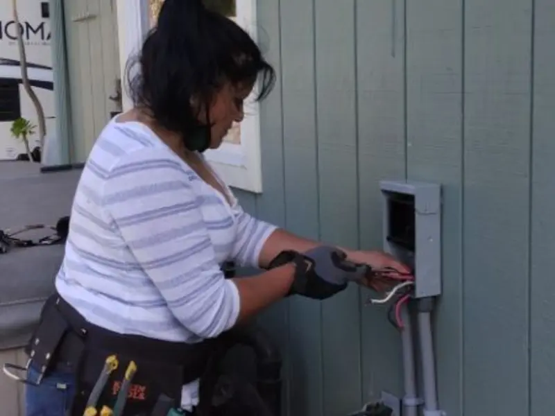 Licensed electrician wiring an exterior subpanel in Mead Valley