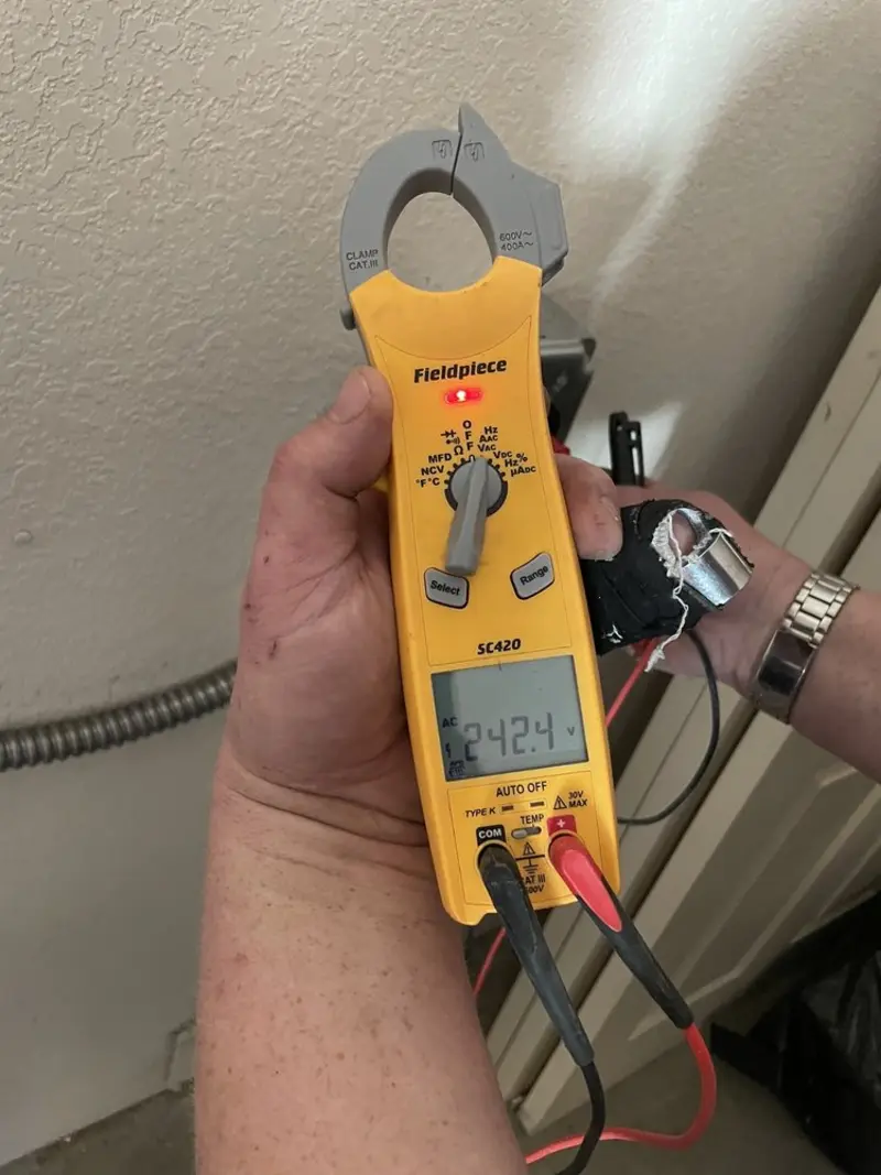 Voltage testing with clamp meter during Generator Installation in Mead Valley